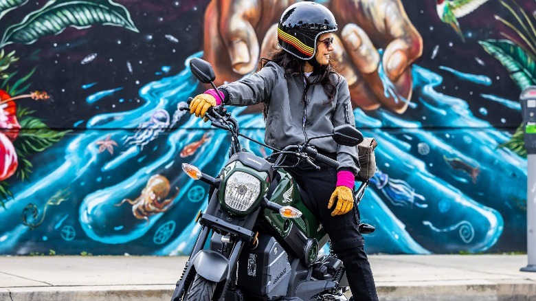 Person sitting on Honda Navi