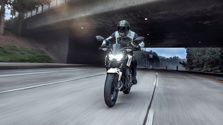 Person riding Z400 on highway