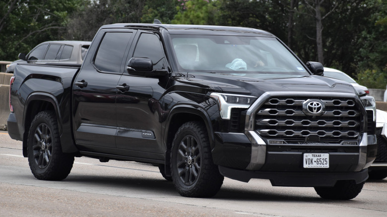 A black Toyota Tundra on the road.