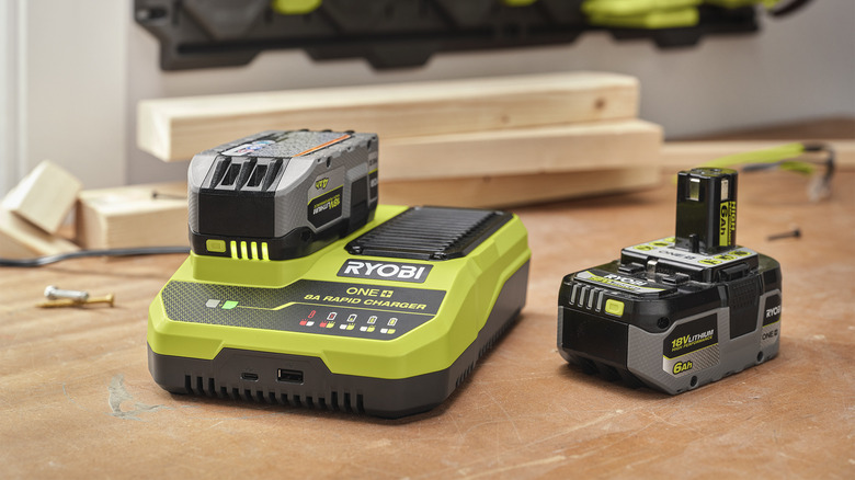 RYOBI Rapid Charger on a table next to wood blocks and RYOBI ONE+ battery