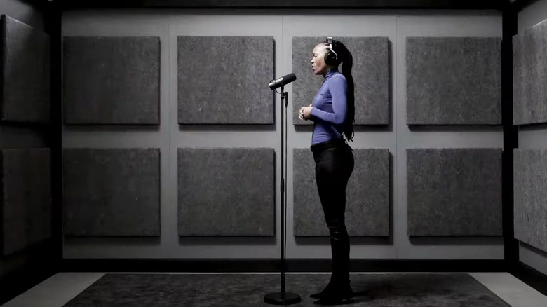 woman singing into Shure SM7B microphone