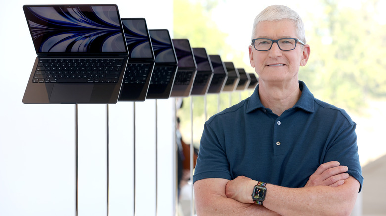 Tim Cook with a row of MacBook Airs