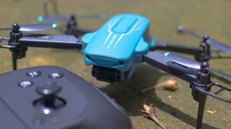 Oviliee S17 mini drone parked near controller