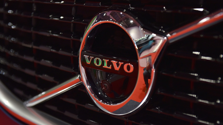 A close-up look at the Volvo badge on a car grille