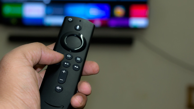 Person holding Fire TV remote