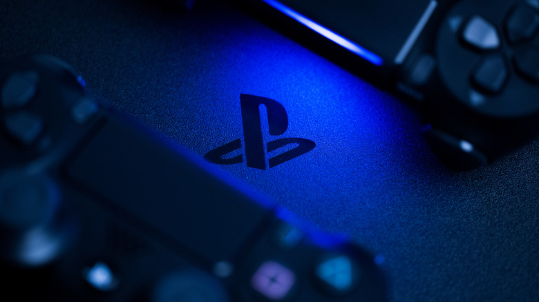 PlayStation logo surrounded by PS4 DualShock controllers