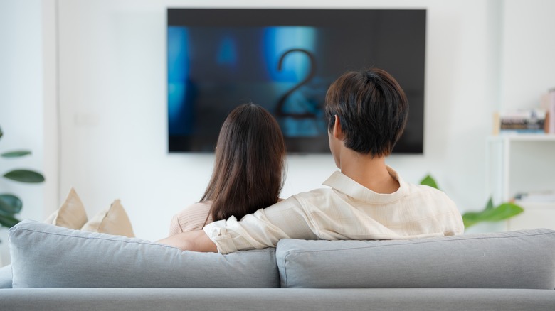 Couple watching TV from their couch