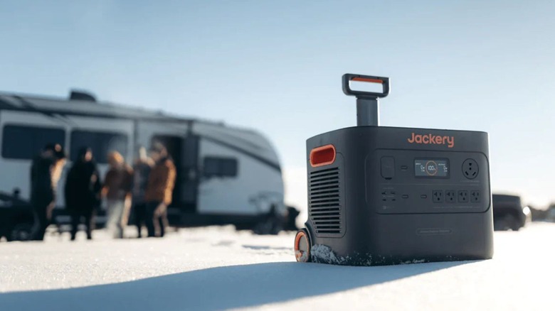 Jackery 3000 Pro in the snow with handle showing and RV in background