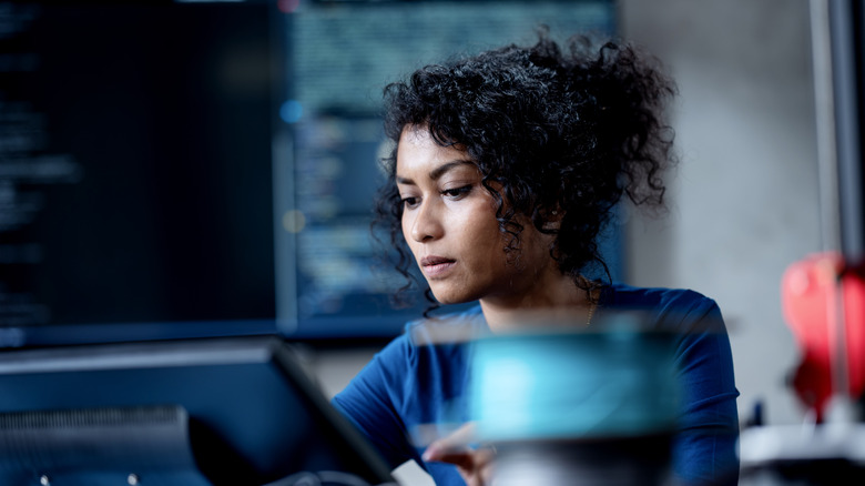 Woman looking at computer monitor