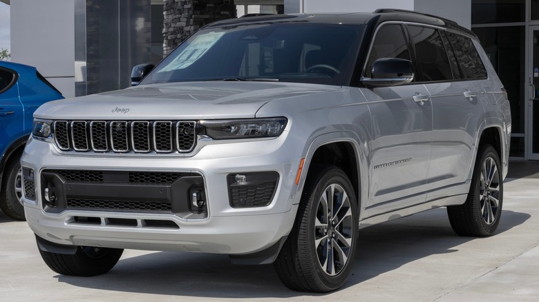 Silver Grand Cherokee Overland parked dealership