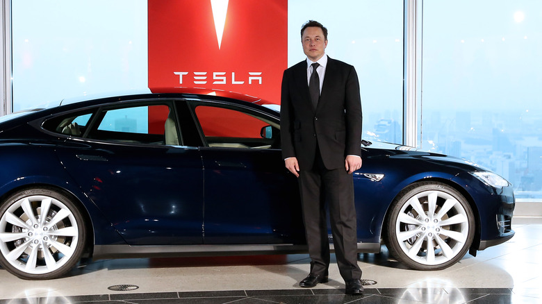 Musk with a Tesla car.