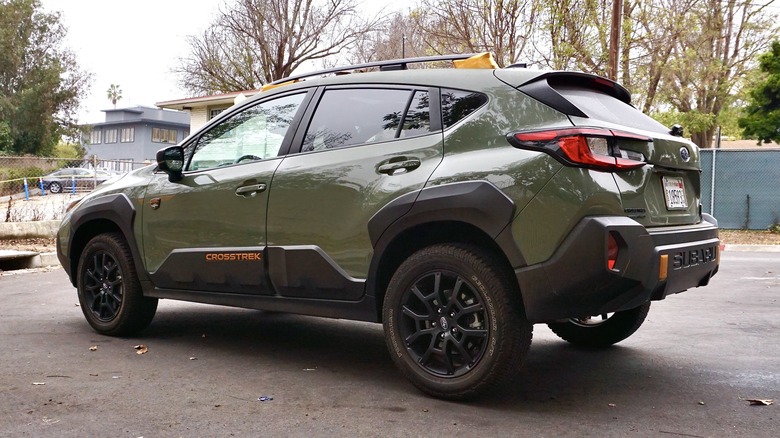 Green Subaru Crosstrek Wilderness rear 3/4 view