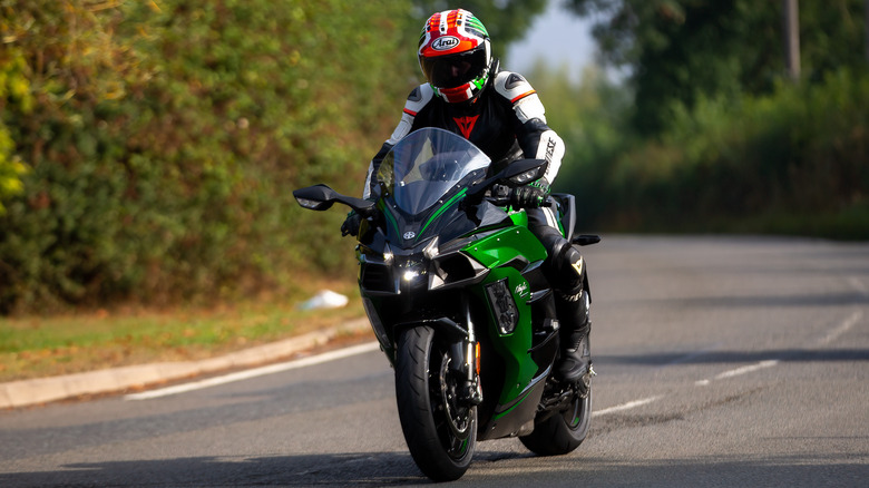 person riding Kawasaki Ninja on road