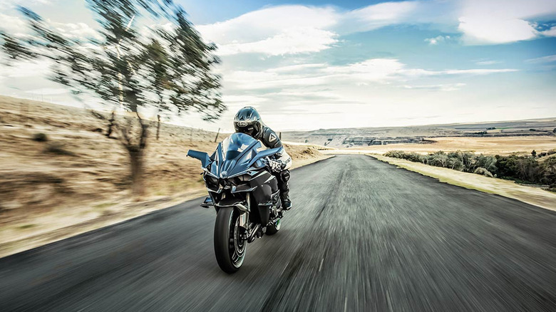 person riding Kawasaki Ninja H2R on road