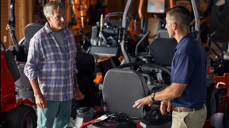 two men discussing a Kawasaki engine