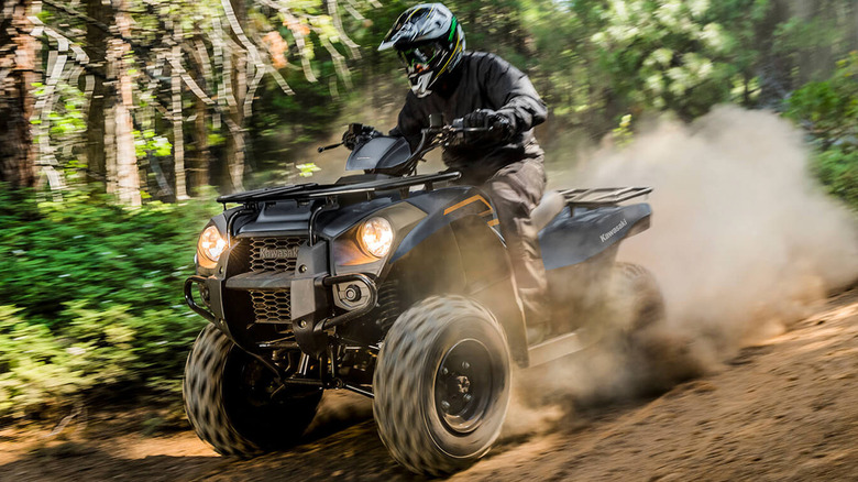 person riding kawasaki brute force 300