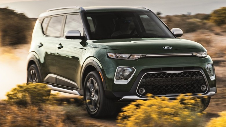 2021 Green Kia Soul driving on a dirt road