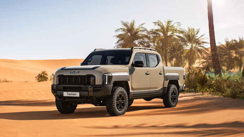 Kia Tasman parked in a desert