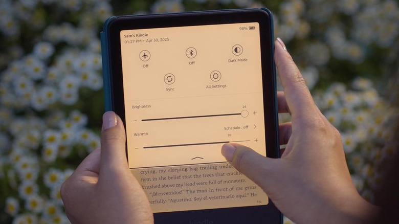 A person using Kindle Paperwhite settings