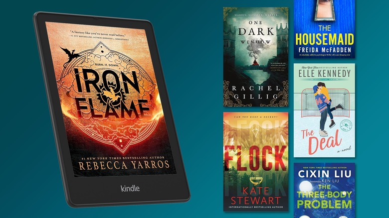 A selection of Kindle e-books next to a Kindle device