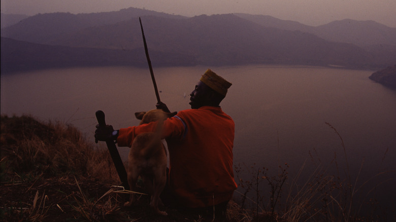 survivor Che Ephriam on a hill overlooking Lake Nyos