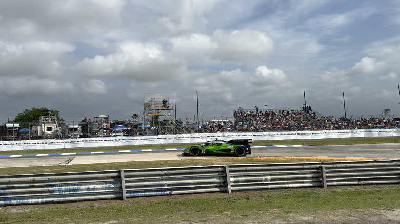 Lamborghini SC63 LMDh car flying through Turn 1 at Sebring