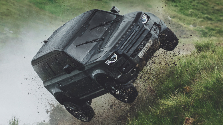 Black Land Rover Defender off-road