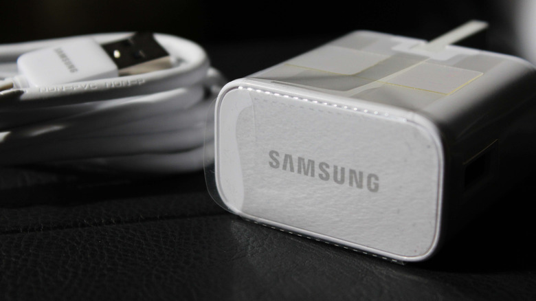 A Samsung charger along with a USB cable.