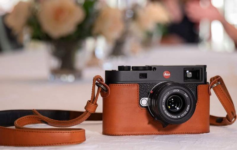 The Leica M11 in black with optional leather case 