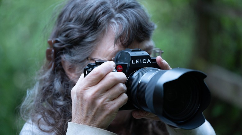 Person taking photo with Leica SL3