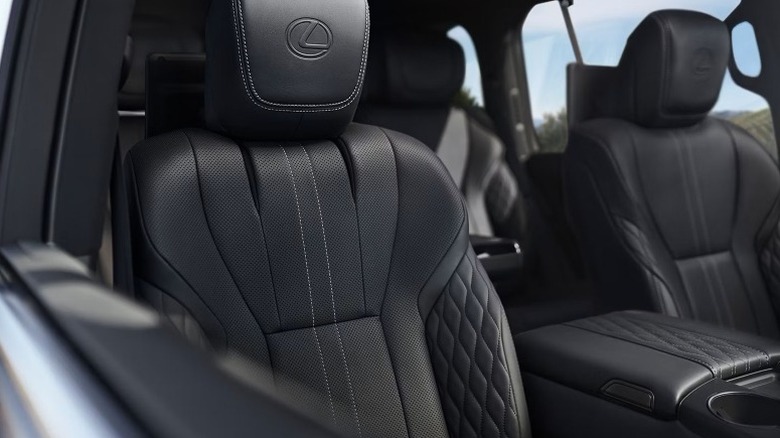 Lexus LX Ultra Luxury interior showing diamond-stitch semi-aniline leather–trimmed seats with embossed headrests