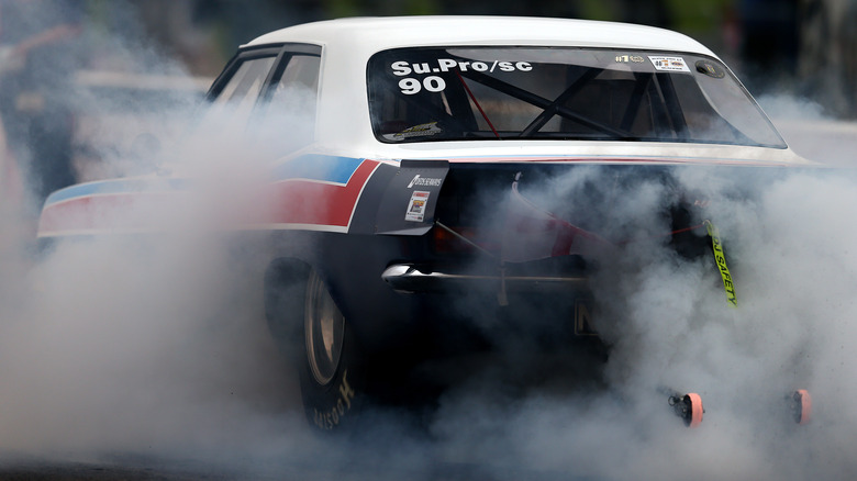 Drag car smoking its tires