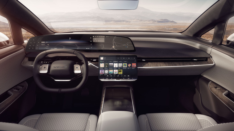 The interiors of the Lucid Gravity electric SUV showing the large curved display.