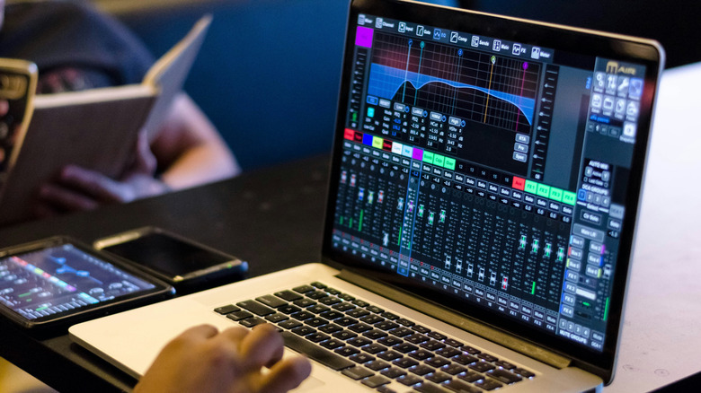 Person working on audio software on MacBook