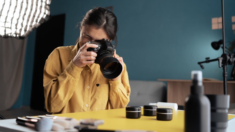 person using camera for a product shoot