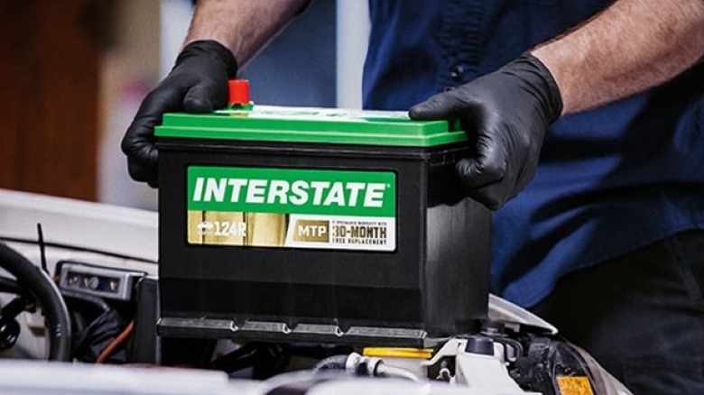Technician installing Interstate battery