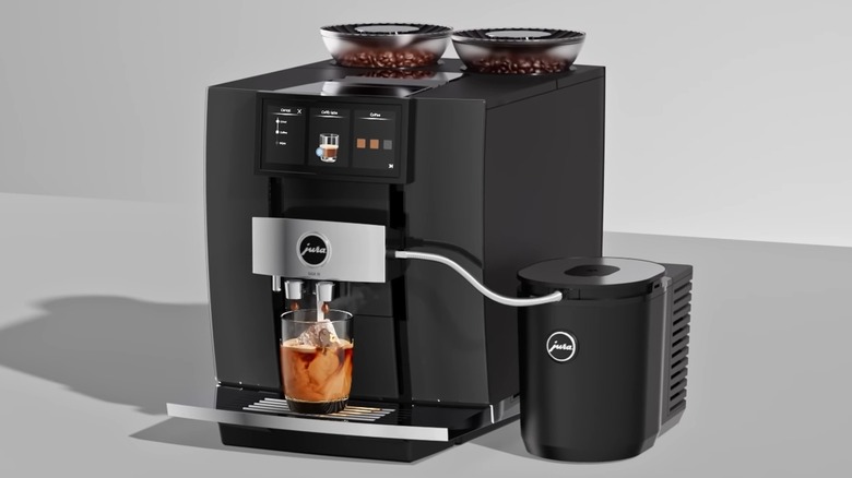 woman in kitchen making espresso