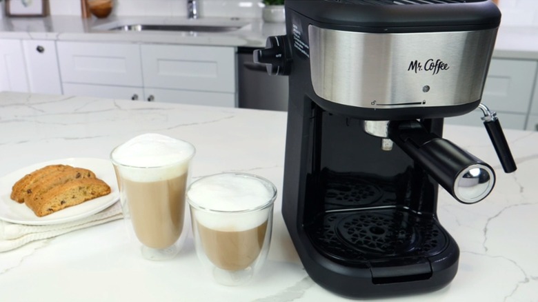 Espresso machine pouring coffee