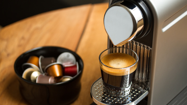 Espresso machine pouring coffee