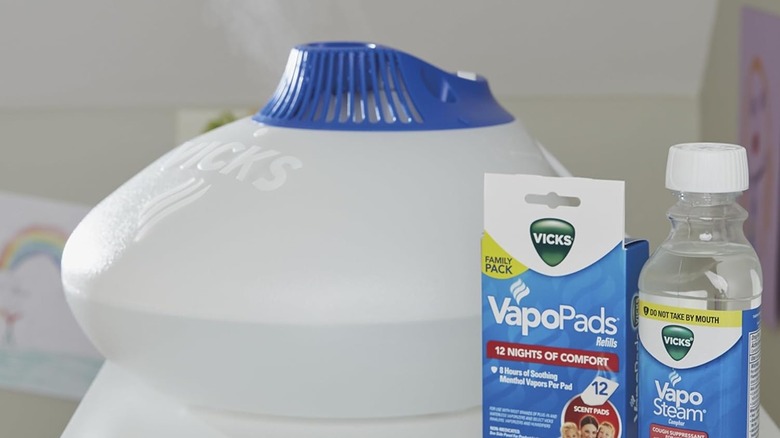 Warm Stream Vaporizer on a nightstand with VapoPads and VapoSteam.