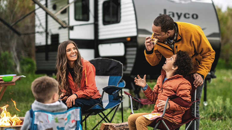 Family outside a Jayco trailer