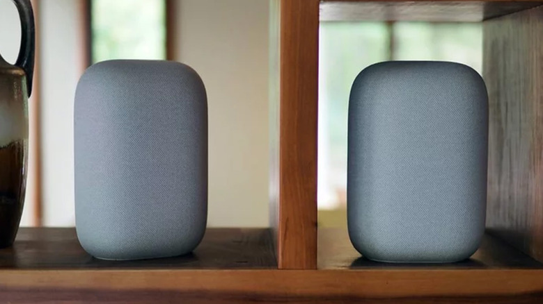 Two Google Nest Audios on shelves