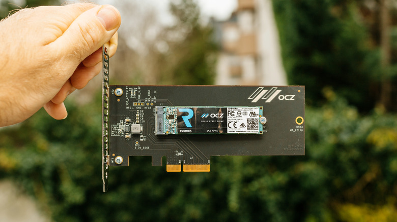 an OCZ SSD being held by a hand