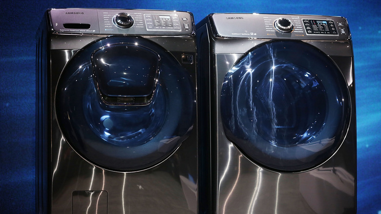 Two front load Samsung washers side by side