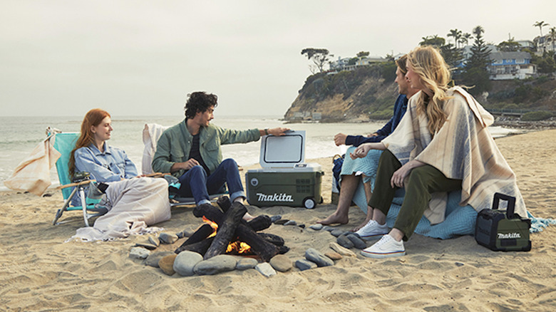 people using Makita Outdoor products on beach