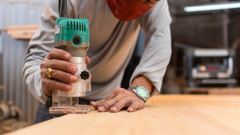 Person uses a compact router