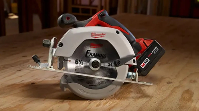 Milwaukee circular saw sitting on a piece of wood