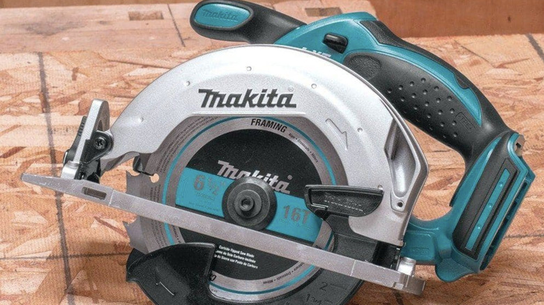 Makita circular saw sitting on a piece of wood