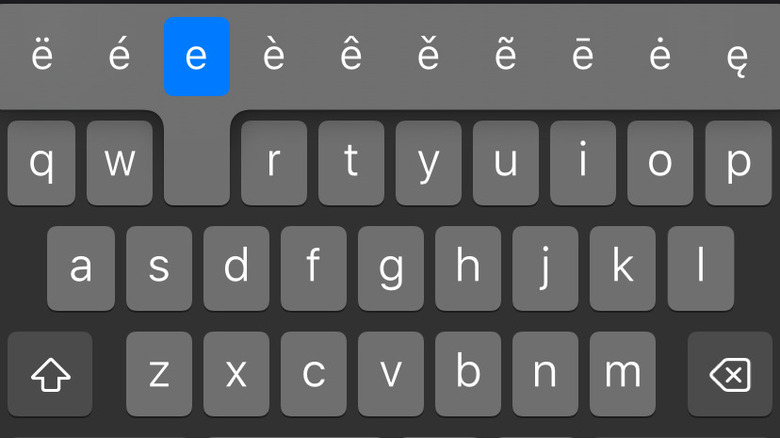 iPhone keyboard with "e" key pressed and held