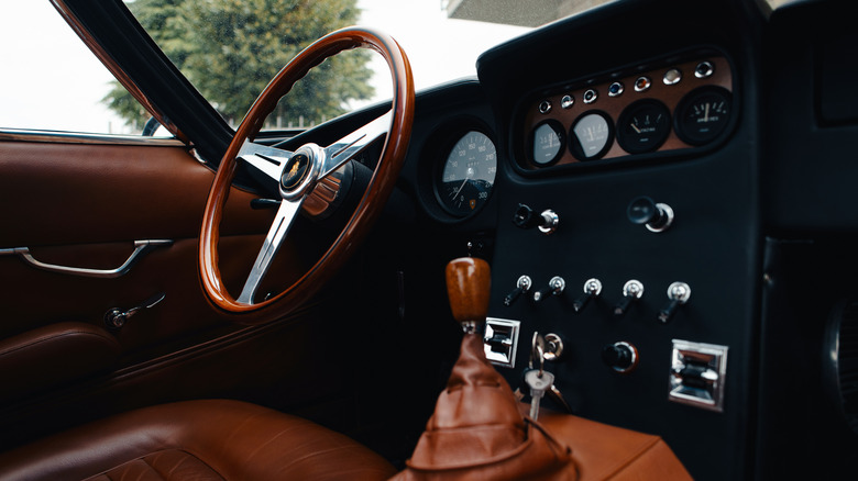 The classic interior of the 400 GT, with wooden steering wheel and shifter.